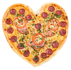 pizza in the shape of a heart with tomatoes, ham