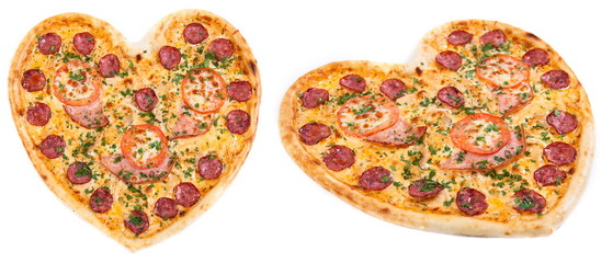 Meat pizza with ham, salami, tomatoes and cheesein heart shape