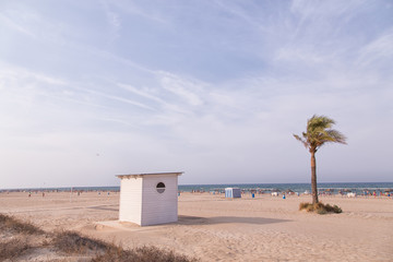 Obraz premium Gandia, SPAIN - JULY 27 2014: People sunbathing on the beach of