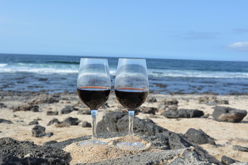 Celebration With Two Glasses Of  Red Wine On The Tropical  Beach
