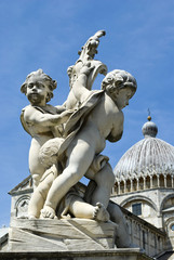 Fototapeta na wymiar Sculptures of angels on the fountain in Pisa