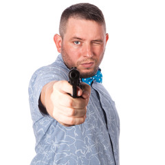 Serious adult man in summer shirt with a firearm