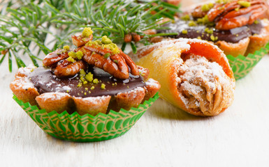 Cupcake with Christmas decoration  on a wooden table.