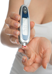 Diabetes patient measuring glucose level blood test