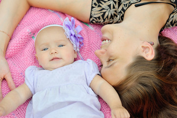 Mother and baby in park portrait