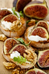 Canape with fresh figs, goat cheese and walnuts