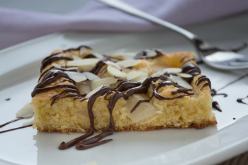 Apple sponge cake with chocolate and almonds