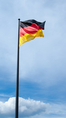 German flag against blue sky