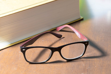 Glasses and a big book
