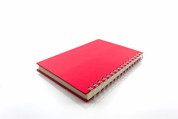 Red diary book on white background.
