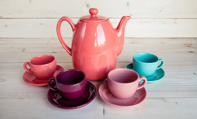 teapot and cup on a wooden tray
