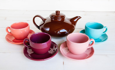 teapot and cup on a wooden tray