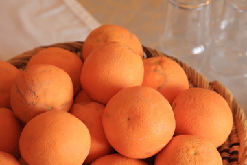 Oranges in a Pile on a Breakfast Table