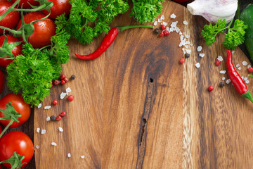 wooden board background, fresh tomatoes, spices and herbs