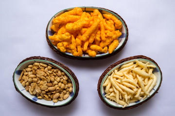 Snacks on ceramic and rattan fancy platter from top view