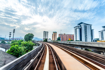 Fototapeta premium Sky train through the city center in Kuala Lumpur,motion blur