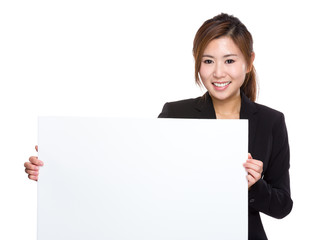 Naklejka premium Businesswoman hold with white poster