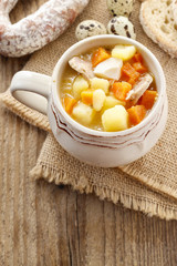 Portion of the sour rye soup made of soured rye flour and meat
