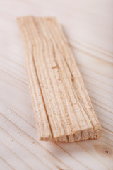 Wood shavings on wooden background