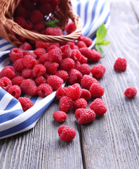 Ripe sweet raspberries on table close-up