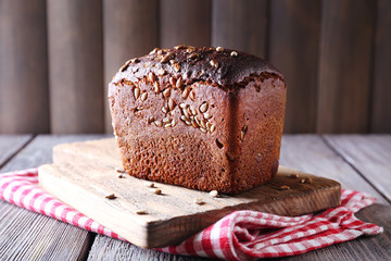 Fresh bread on wooden table, close up