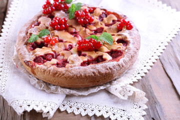 Tasty cake with berries on table close-up