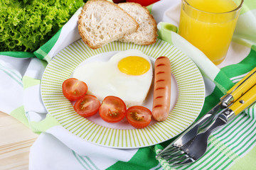 Scrambled eggs with sausage and vegetables served