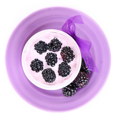 Healthy breakfast - yogurt with  blackberries and muesli served