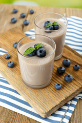 Delicious berry mousse in glasses on table close-up