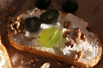 tasty bread with grape and cheese, close up