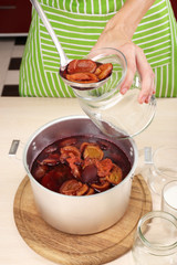 Cooking delicious drain jam in kitchen
