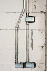 electric system on wall  in construction site  ,outlet with iron