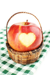 Red apple with heart isolated on white