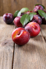 Sweet plums on wooden background