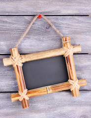 Rectangular chalkboard on wooden background