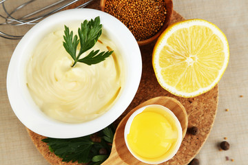 Mayonnaise ingredients on wooden background