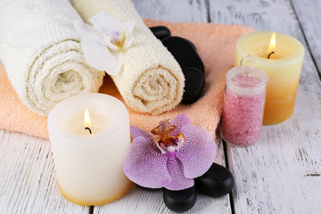 Still life with beautiful blooming orchid flower, spa set