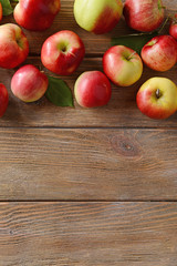 Sweet apples on wooden background