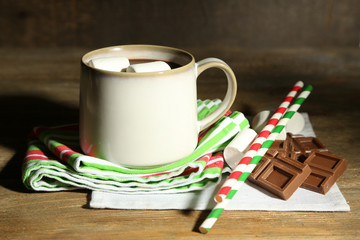 Hot chocolate with marshmallows, on wooden background