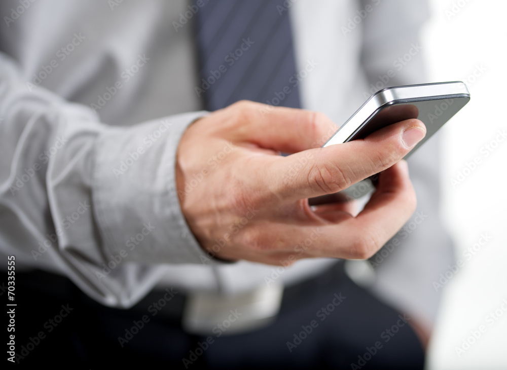 Wall mural man using phone