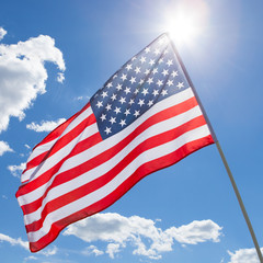 USA flag waving on blue sky background - 1 to 1 ratio