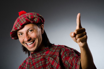 Funny scotsman in traditional clothing