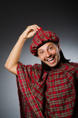 Funny scotsman in traditional clothing