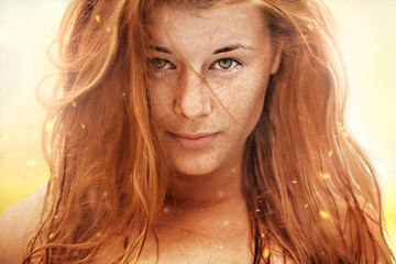 Summer portrait, beautiful freckled young woman with red hair