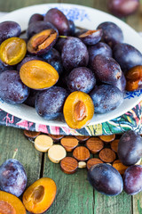 fresh juicy plums on a wooden board
