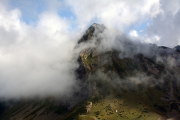 A mountain behind the cloud