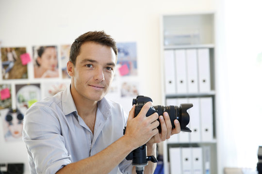 Photographer working in photo agency