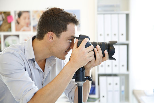 Photographer working in photo agency