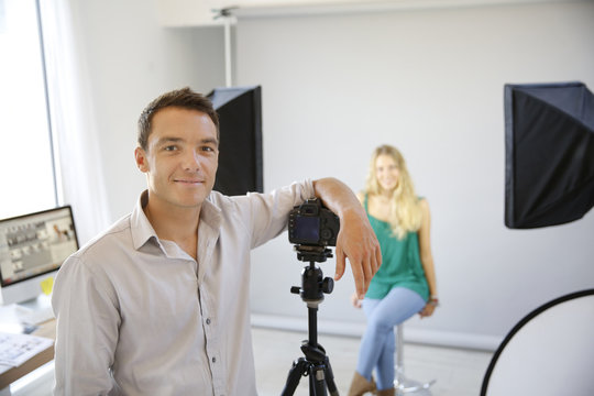 Fashion photographer at work in studio