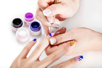 Closeup image of nail artist working